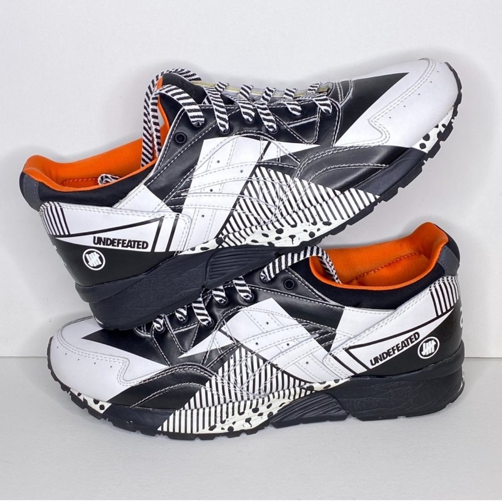 Undefeated Monochrome Sneakers with Vibrant Orange Lining